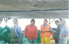 Trabajadores de cultivos marinos